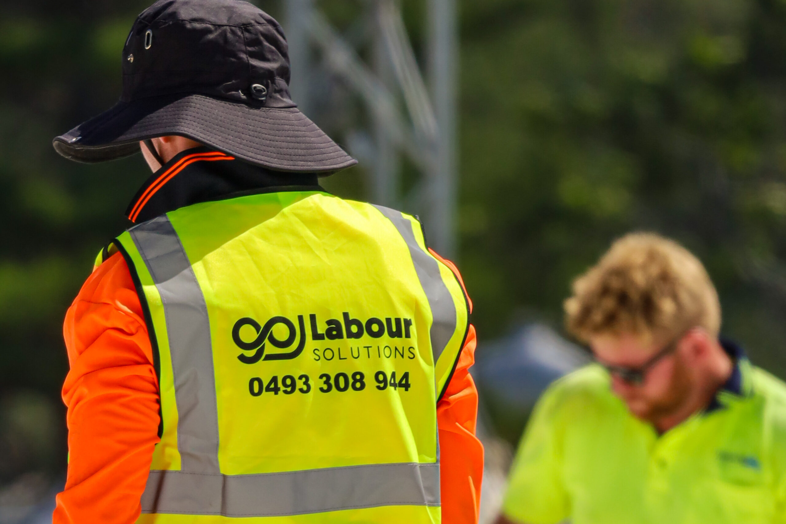 GoLabour crew member on site, branded hi-vis vest